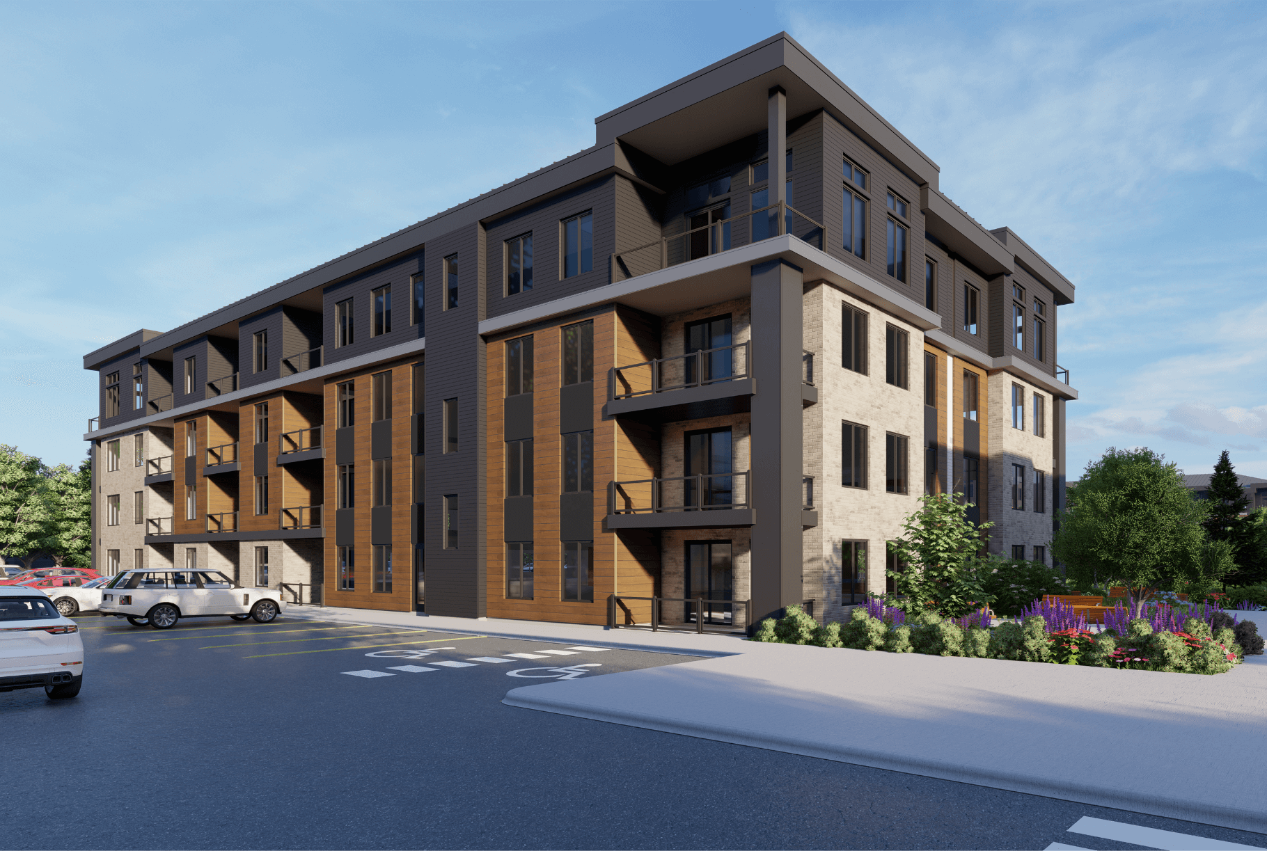 A four storey apartment building with balconies and parking lot.